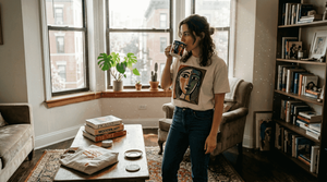 Woman wearing Picasso-inspired t-shirt in apartment